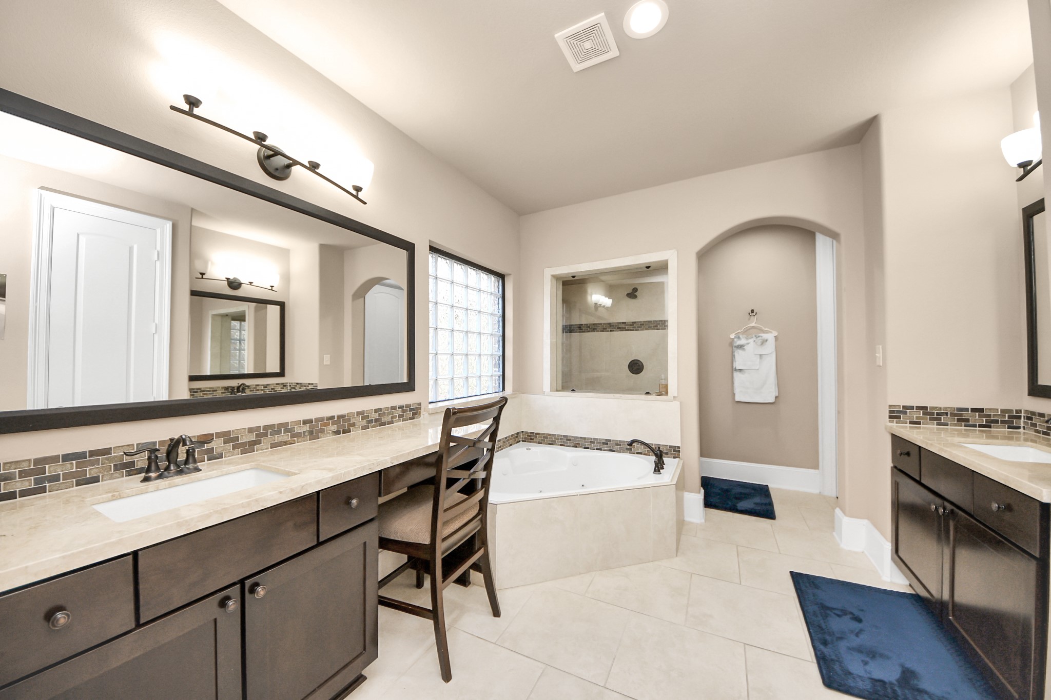 8447 Roland Canyon Drive Cypress, TX 77433 - Photo 35 of 48 a spacious bathroom with a sink double vanity and a mirror