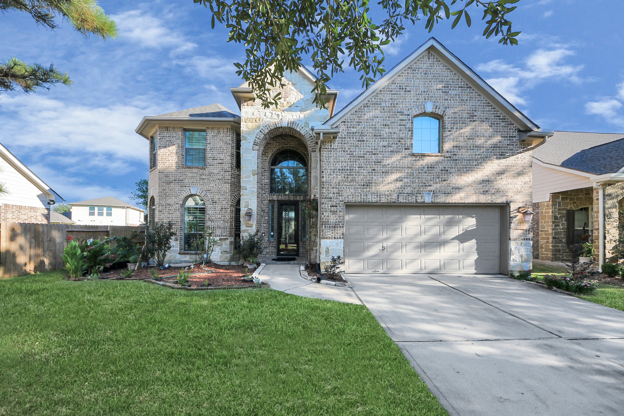 8447 Roland Canyon Drive Cypress, TX 77433 - Photo 5 of 48 a front view of a house with swing and slide