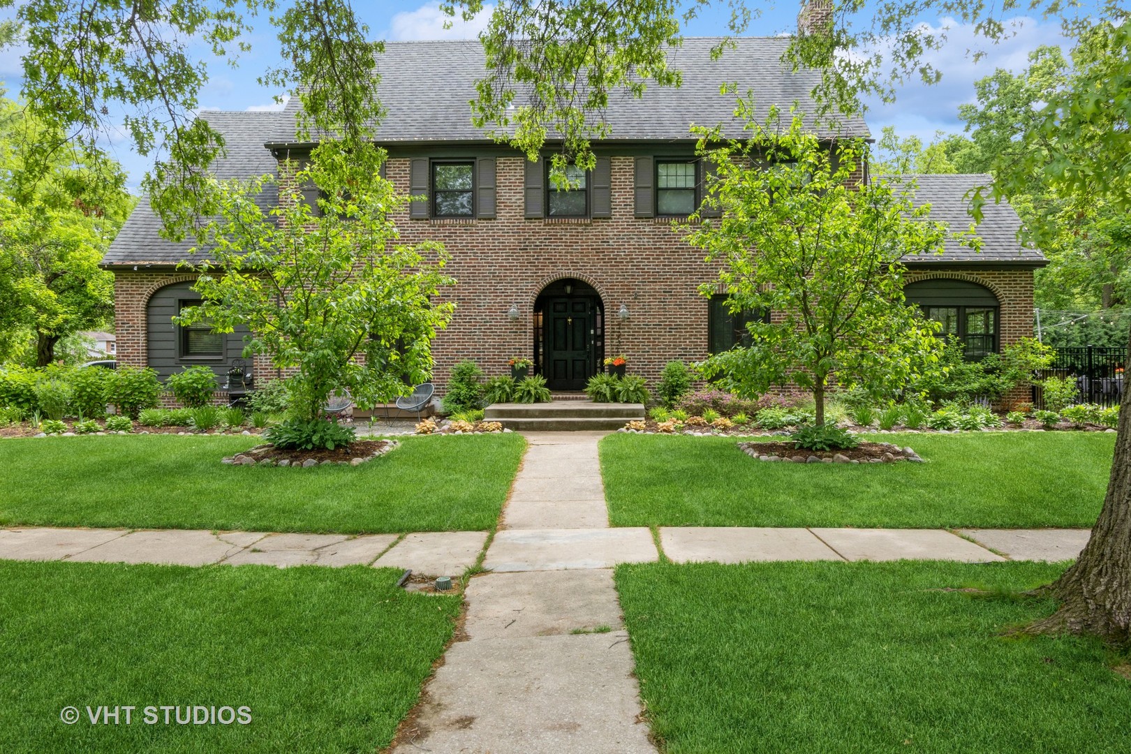 723 Gardner Road Flossmoor, IL 60422 - Photo 2 of 48 a front view of a house with a garden and plants