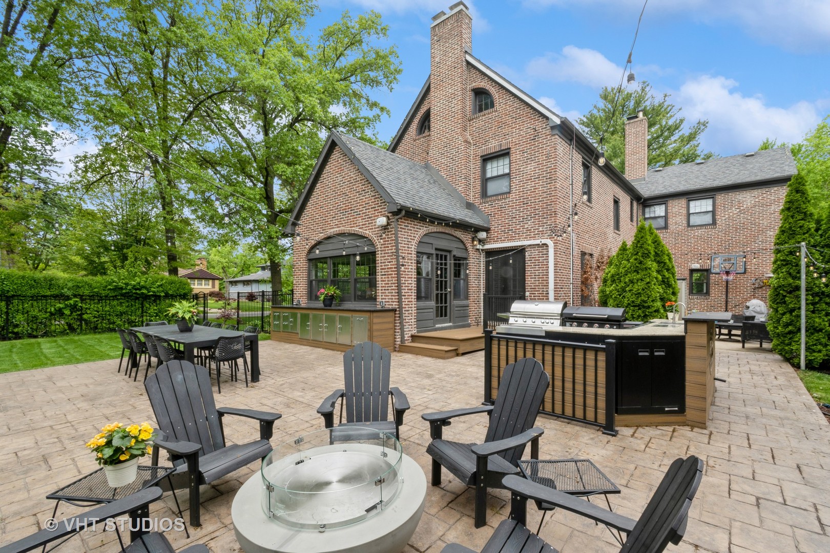 723 Gardner Road Flossmoor, IL 60422 - Photo 39 of 48 a view of a patio with table and chairs potted plants and a palm tree