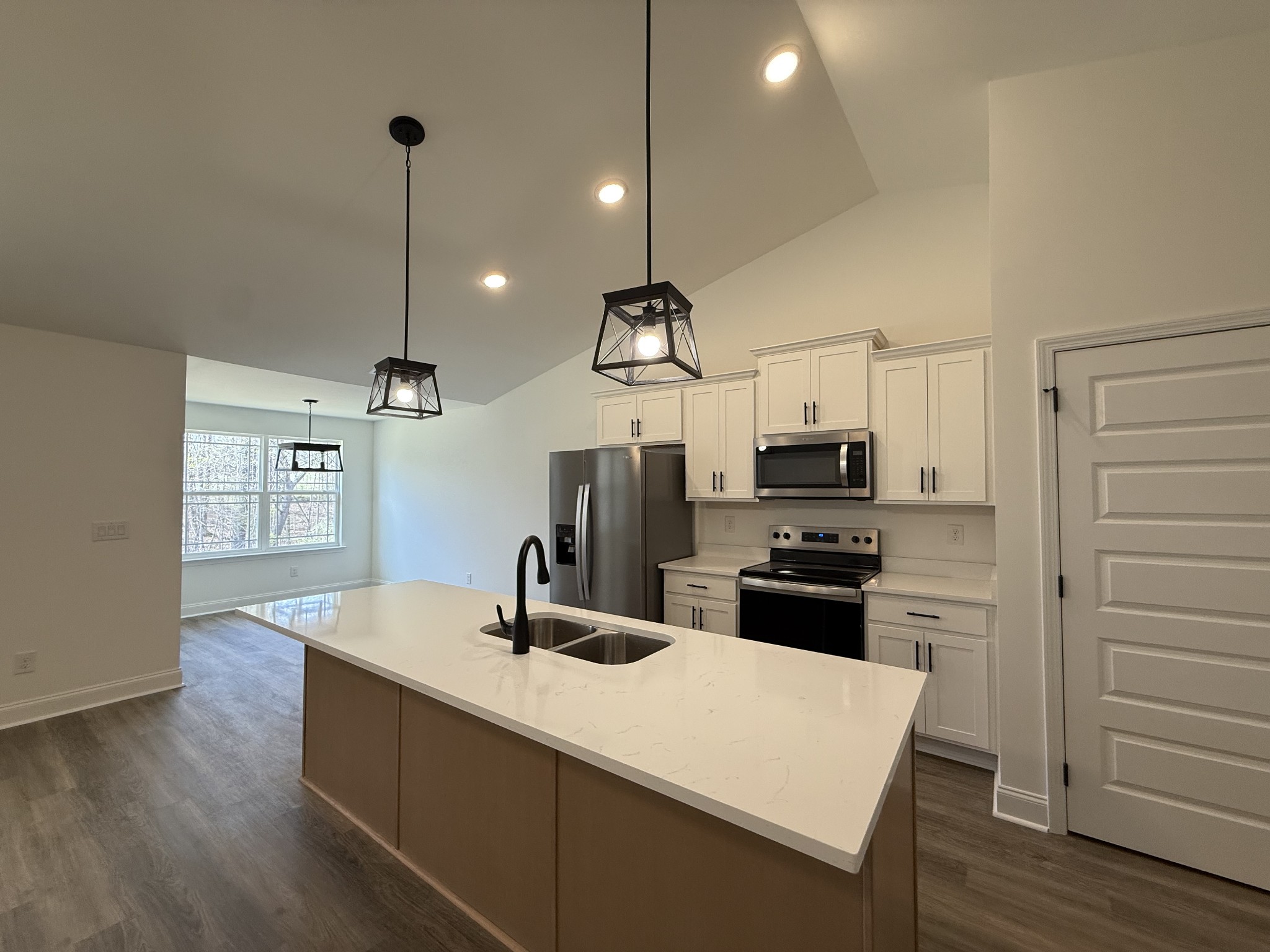508 Mandalorian Way Dickson, TN 37055 - Photo 2 of 8 a kitchen with a sink a counter space appliances and cabinets