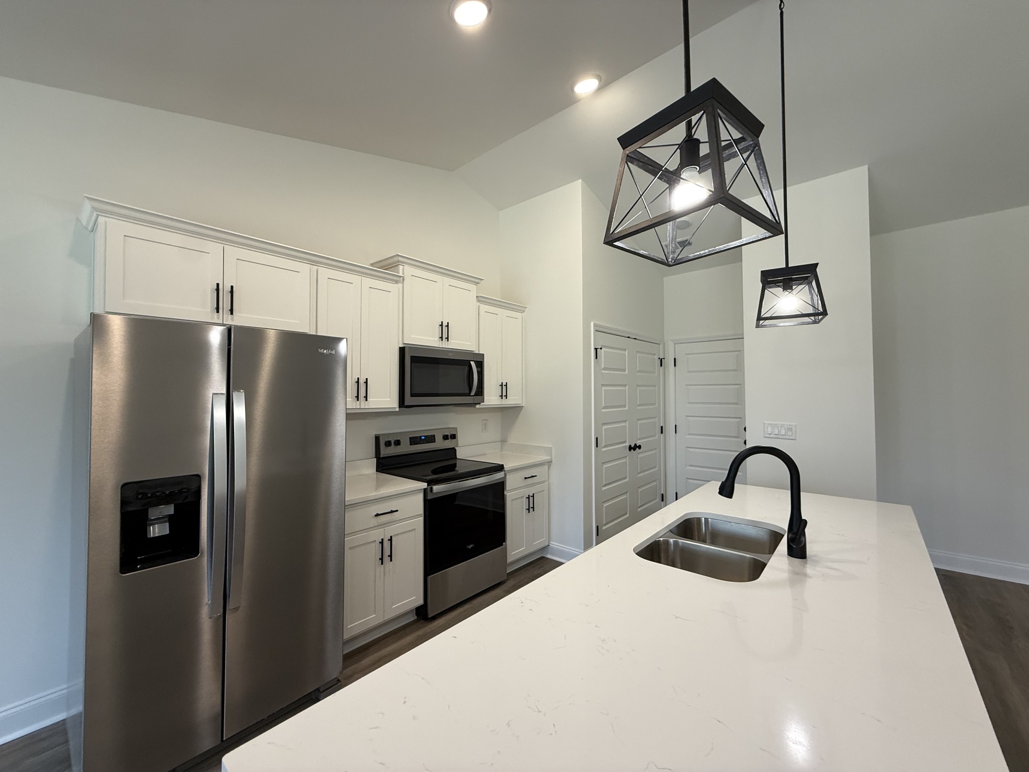 508 Mandalorian Way Dickson, TN 37055 - Photo 6 of 8 a kitchen with stainless steel appliances granite countertop a refrigerator a sink a stove and dishwasher