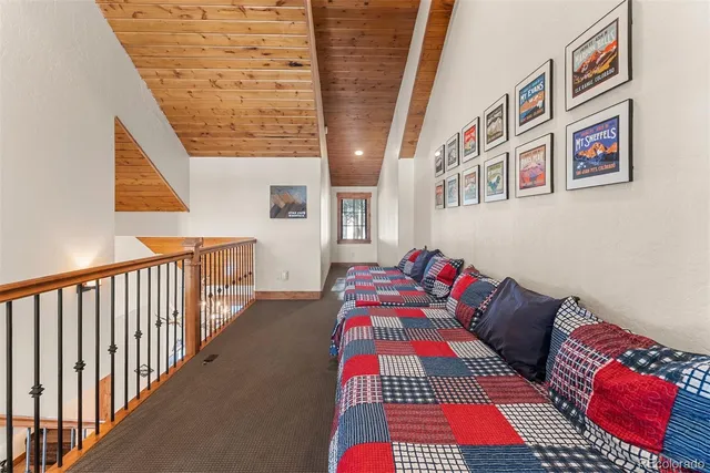 a bedroom with a bed and a book shelf