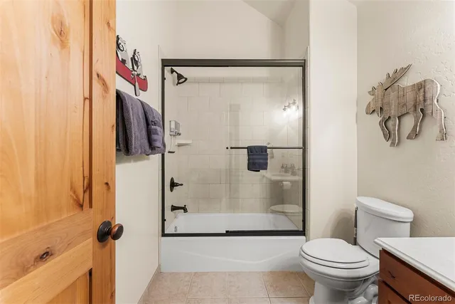 a bathroom with a shower and a toilet