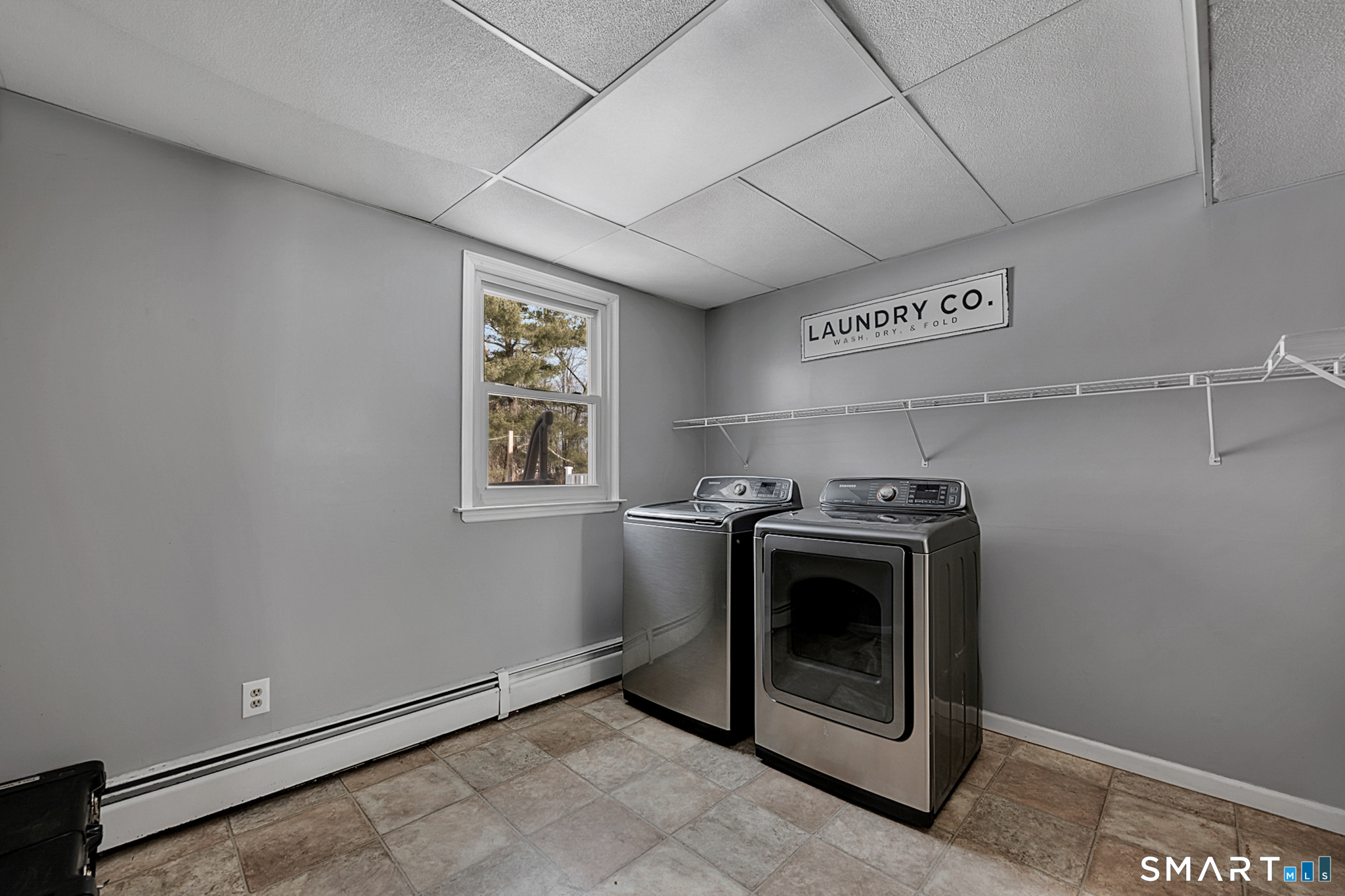 3 Grand Place Newtown, CT 06470 - Photo 14 of 40 Large laundry room with access to the garage, flows into the mudroom and kitchen.