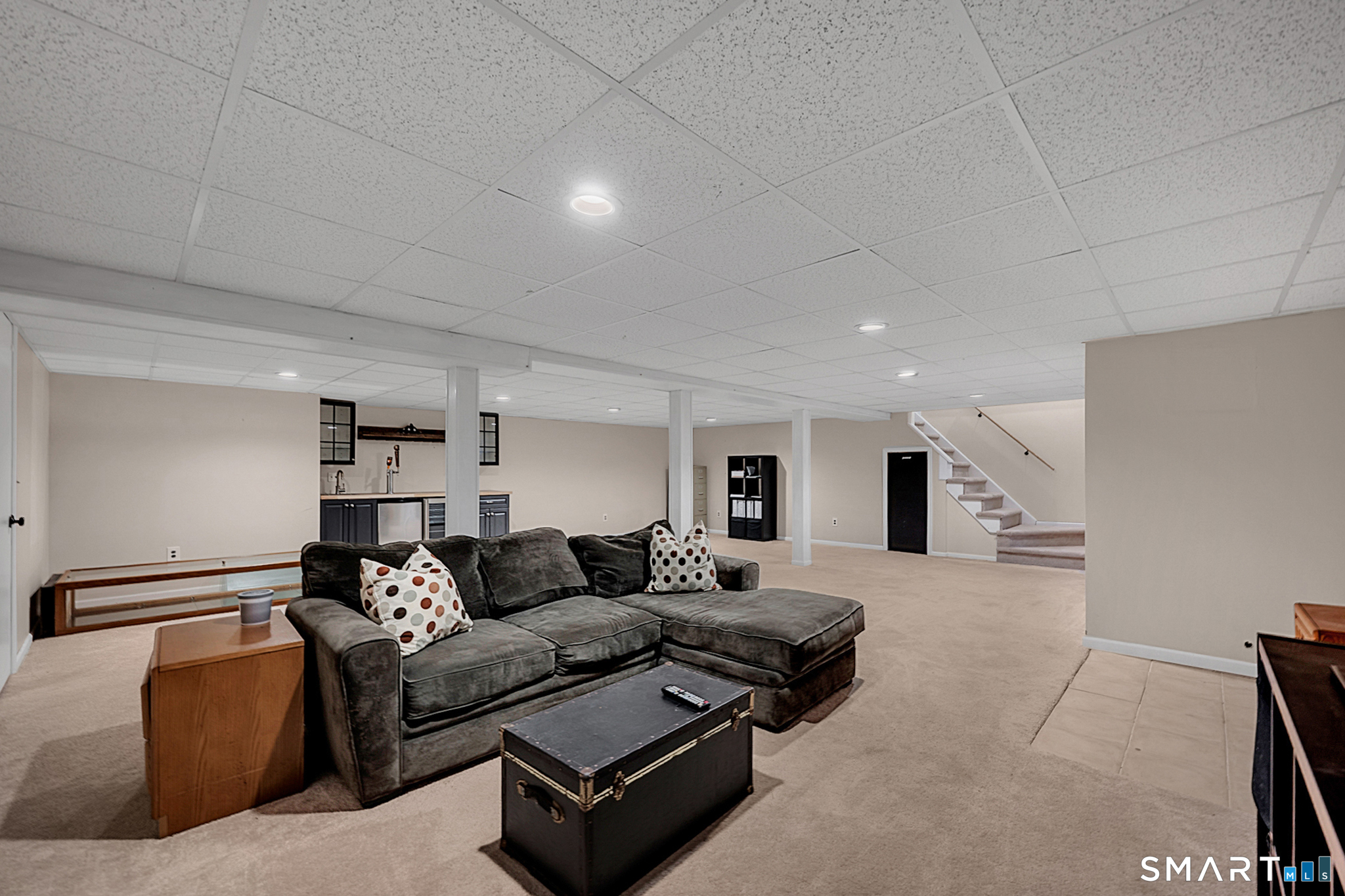 3 Grand Place Newtown, CT 06470 - Photo 21 of 40 The recreation room is located in the lower level. With its generous layout, it offers ample room for comfortable seating and recreational activities.