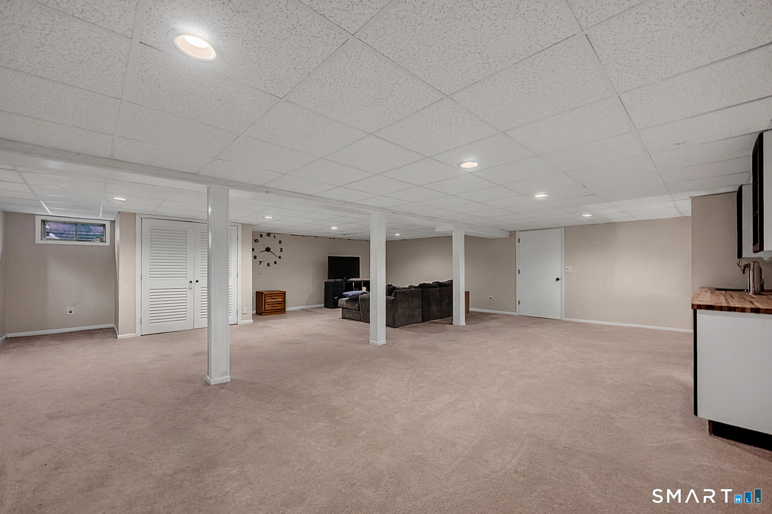 3 Grand Place Newtown, CT 06470 - Photo 22 of 40 This area features plush carpeting and a wet bar.