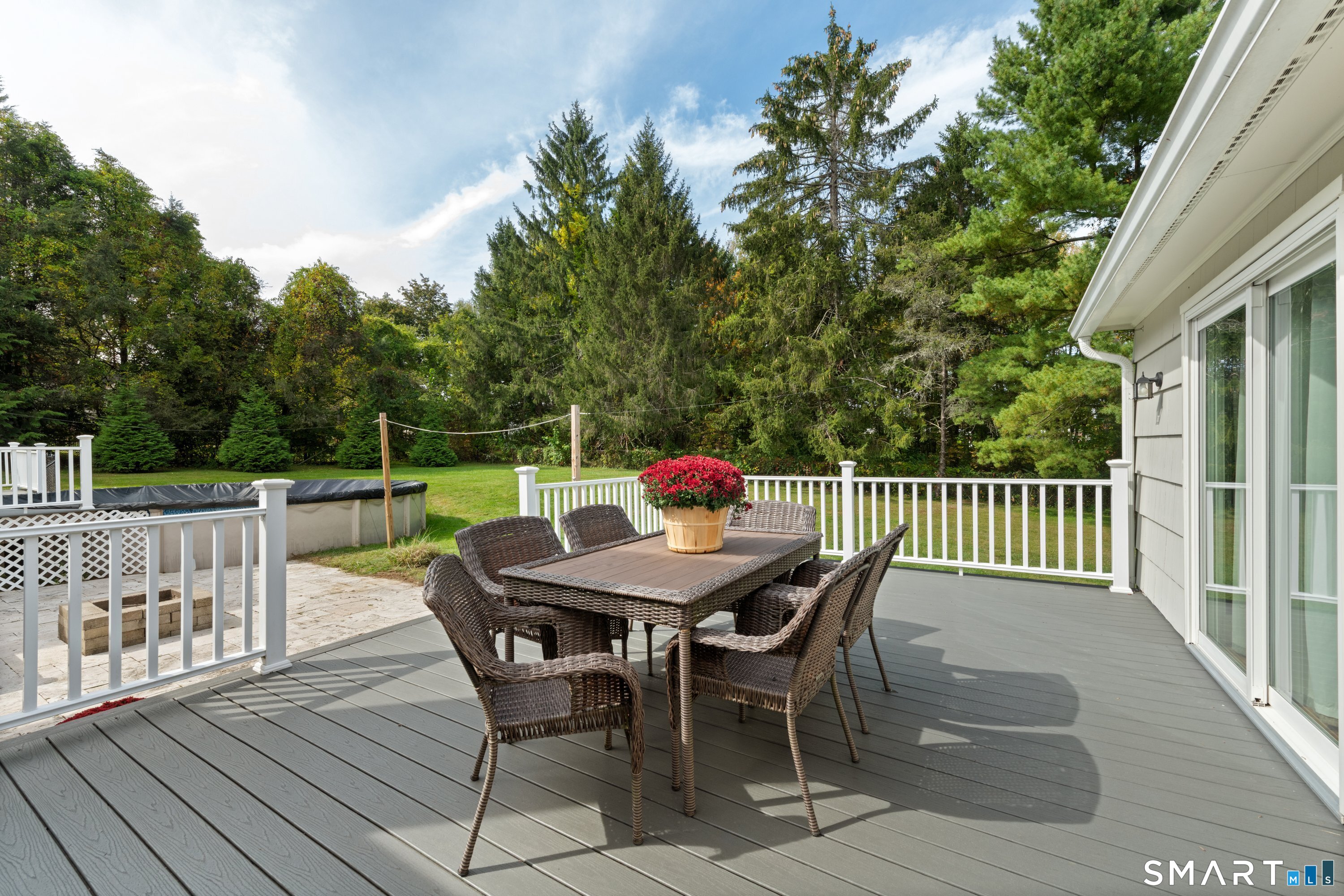 3 Grand Place Newtown, CT 06470 - Photo 29 of 40 The deck has sliders to the living/dining area and another set of sliders to the primary bedroom.