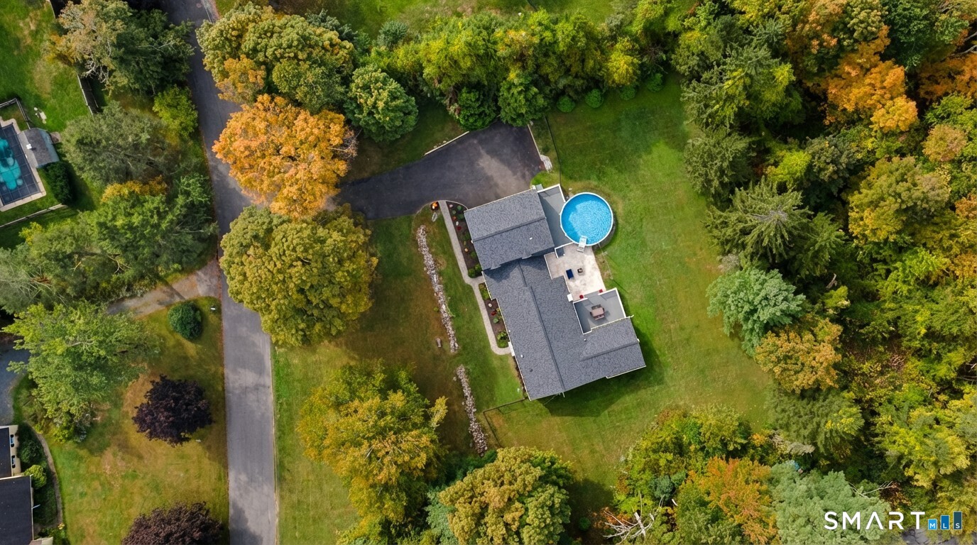 3 Grand Place Newtown, CT 06470 - Photo 33 of 40 Whether hosting family barbecues or enjoying quiet evenings under the stars, this outdoor setting is perfect for relaxation and fun.