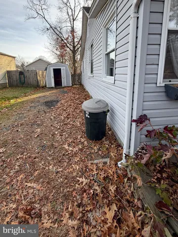a backyard of a house with barbeque oven