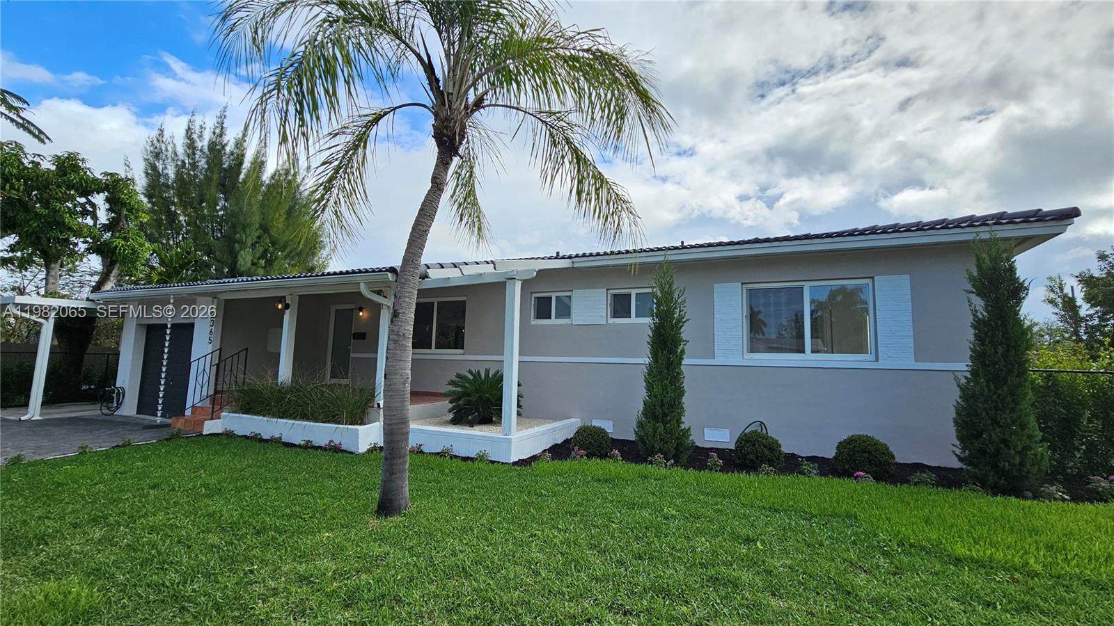 2365 Southwest 21st Avenue Miami, FL 33145 - Photo 11 of 56 a view of a house with a yard and plants
