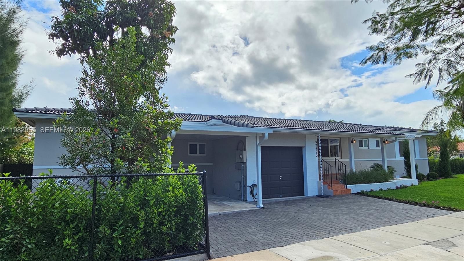 2365 Southwest 21st Avenue Miami, FL 33145 - Photo 13 of 56 a front view of a house with garden