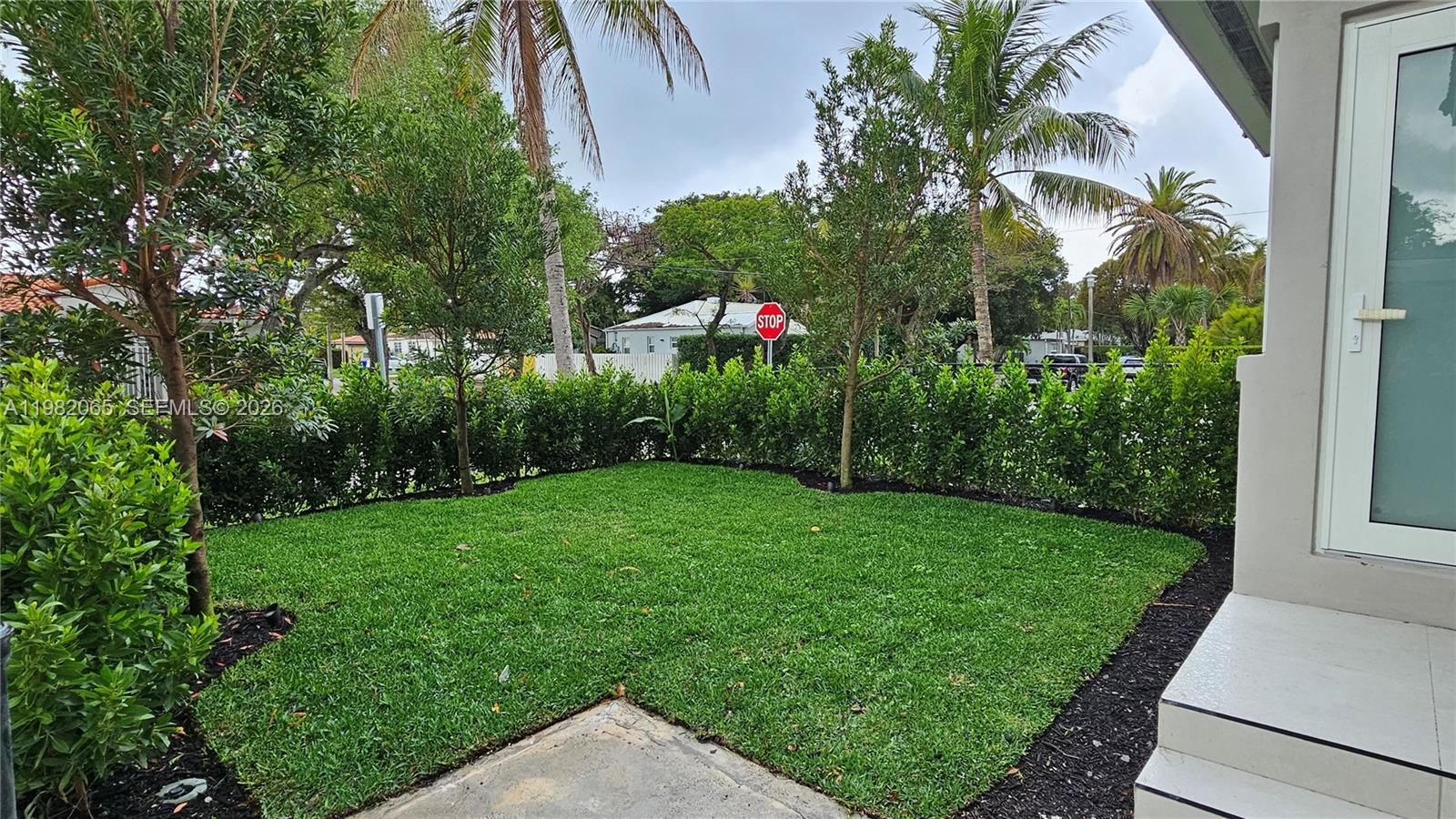 2365 Southwest 21st Avenue Miami, FL 33145 - Photo 18 of 56 a view of a garden with a building in the background