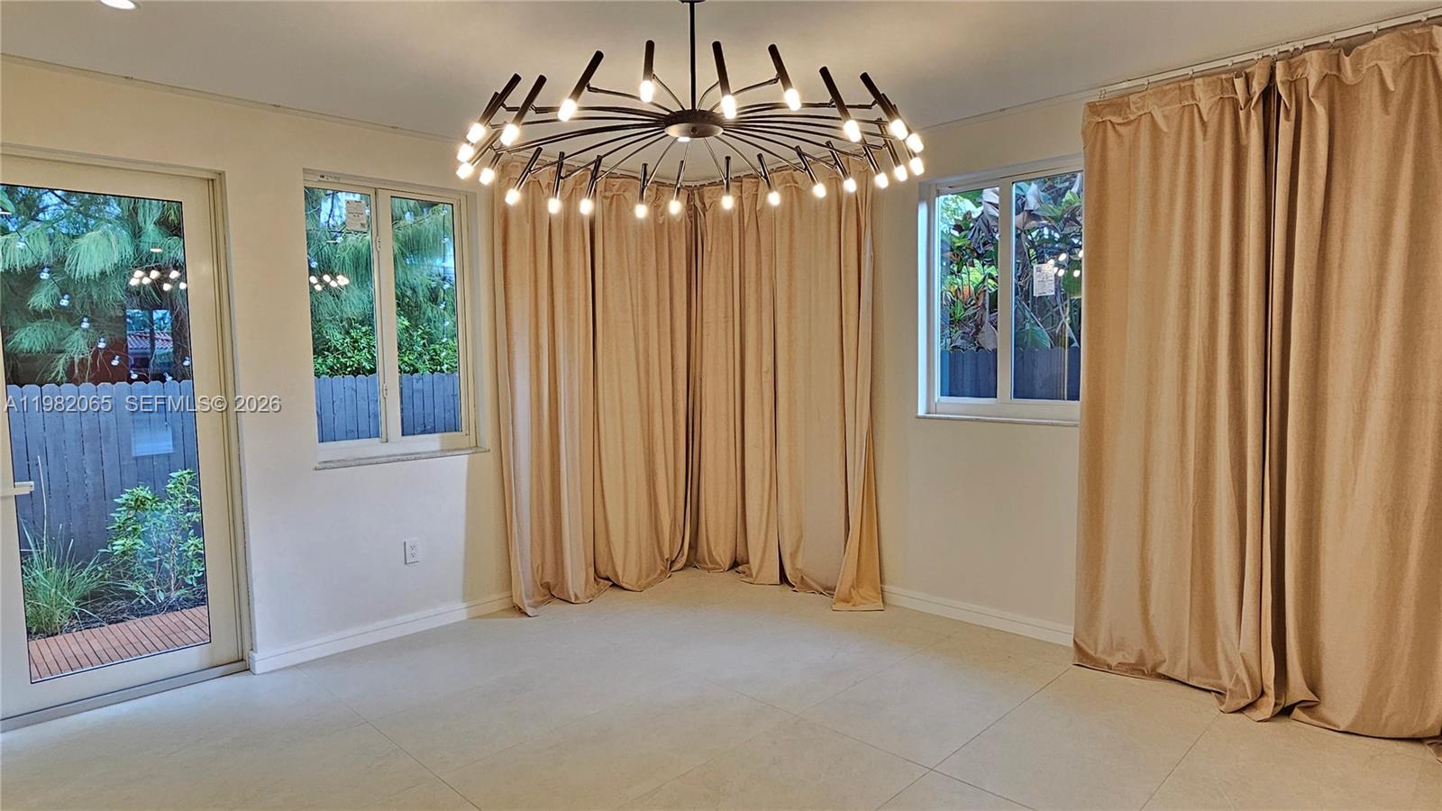 2365 Southwest 21st Avenue Miami, FL 33145 - Photo 38 of 56 an empty room that has a large window and outdoor space