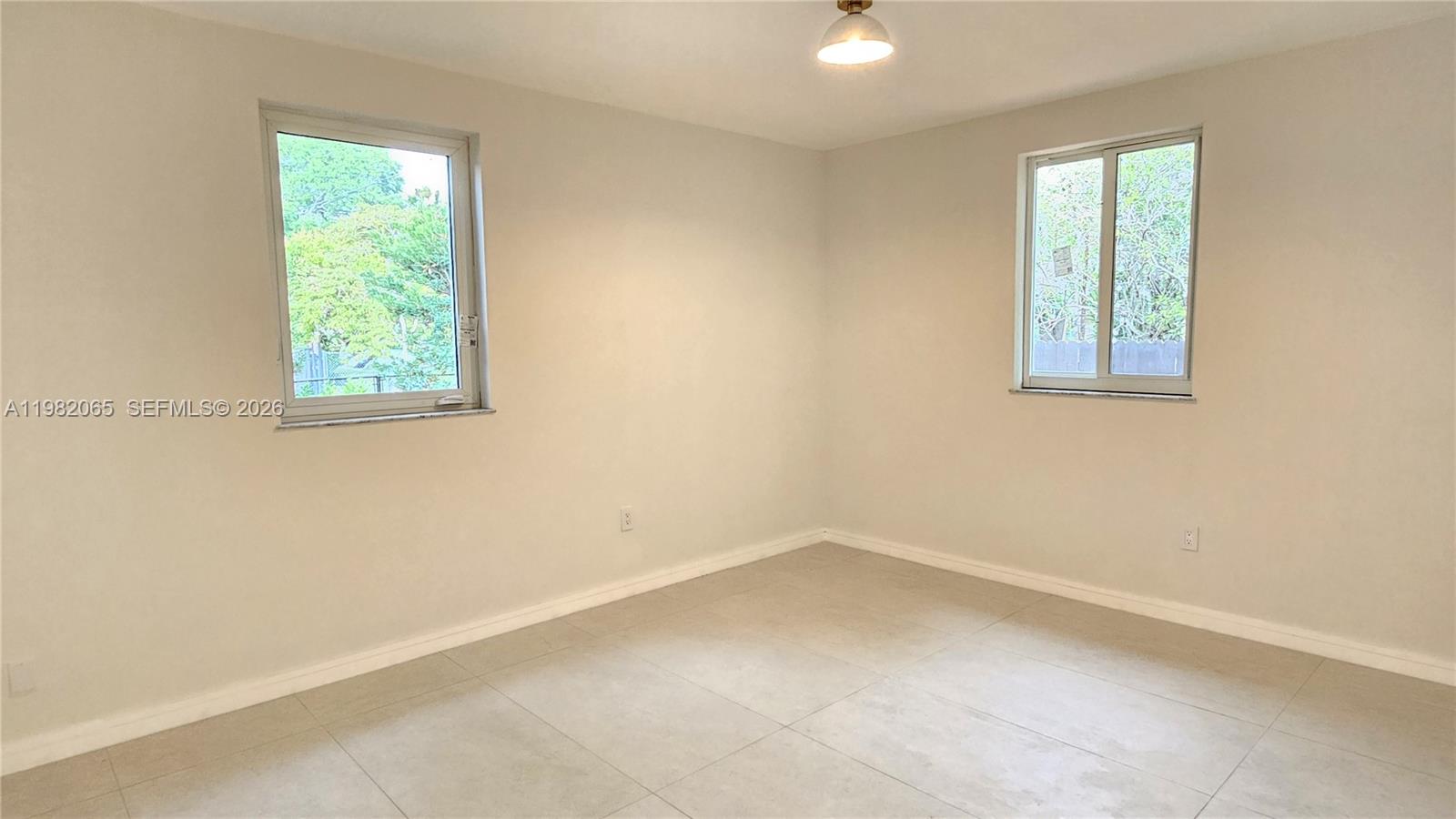2365 Southwest 21st Avenue Miami, FL 33145 - Photo 39 of 56 an empty room with a window