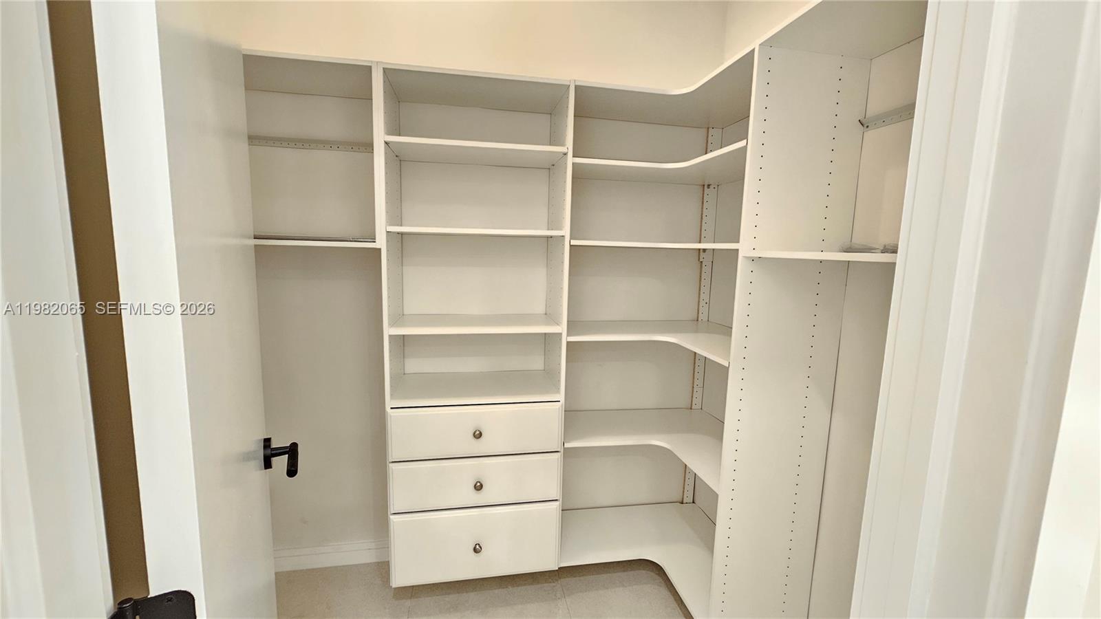 2365 Southwest 21st Avenue Miami, FL 33145 - Photo 42 of 56 a view of walk in closet with empty racks