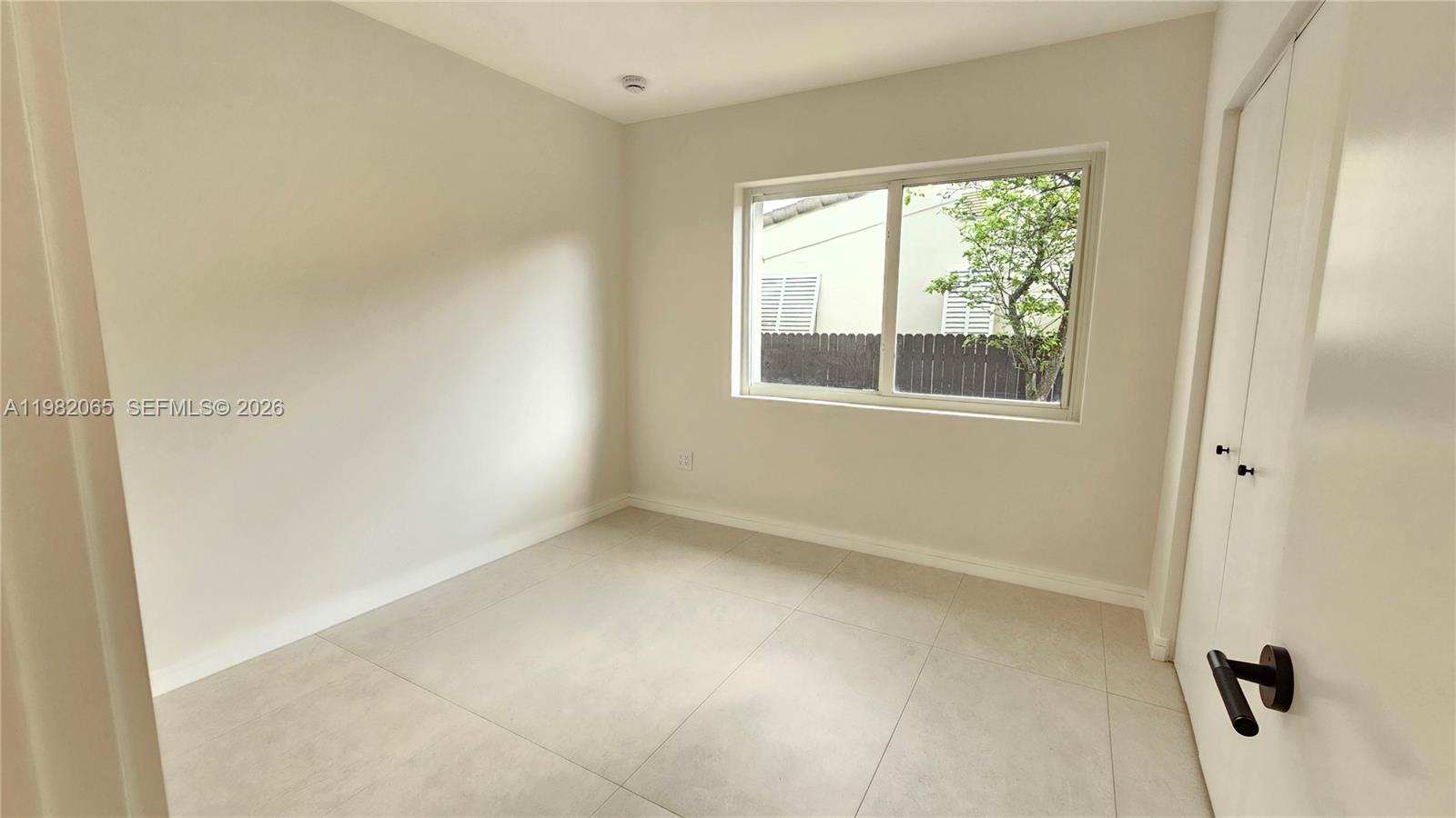 2365 Southwest 21st Avenue Miami, FL 33145 - Photo 45 of 56 an empty room with a window