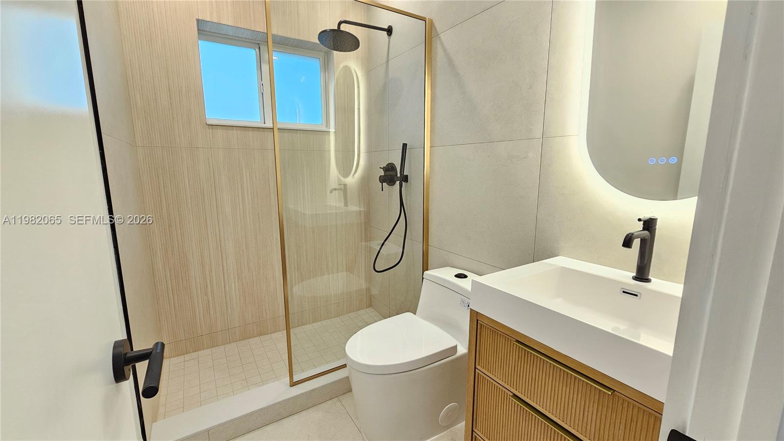 2365 Southwest 21st Avenue Miami, FL 33145 - Photo 47 of 56 a bathroom with a sink toilet and shower