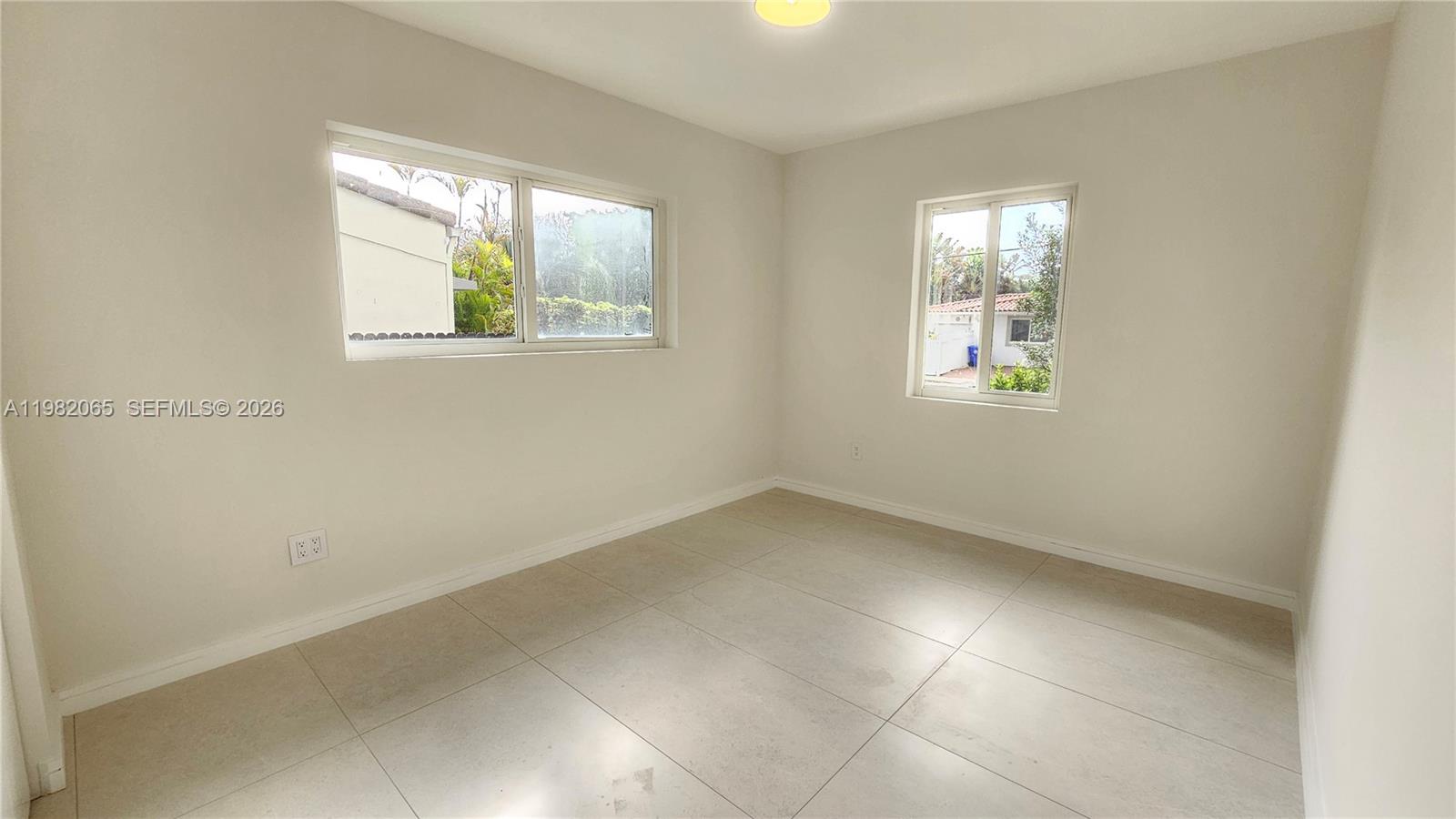 2365 Southwest 21st Avenue Miami, FL 33145 - Photo 48 of 56 an empty room with windows