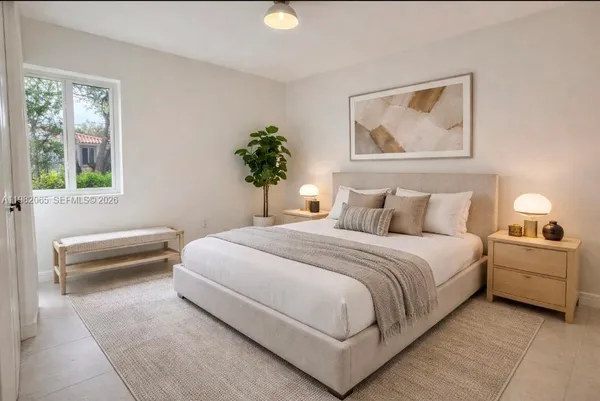 a view of a backyard with plants and a patio