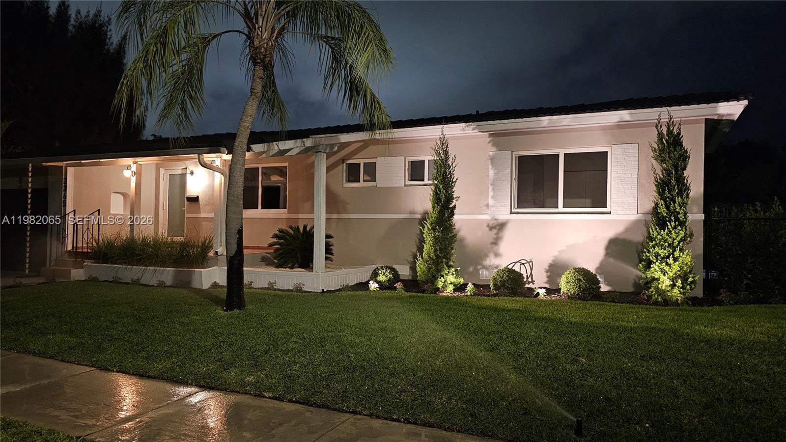 2365 Southwest 21st Avenue Miami, FL 33145 - Photo 53 of 56 a front view of a house with a garden