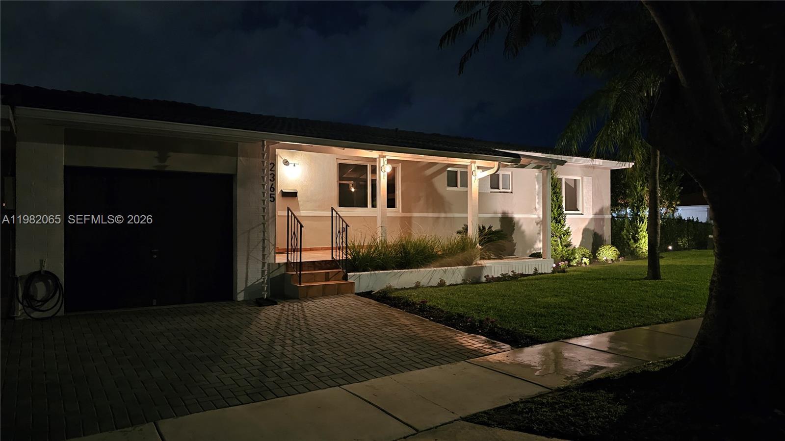 2365 Southwest 21st Avenue Miami, FL 33145 - Photo 54 of 56 a front view of a house with a yard