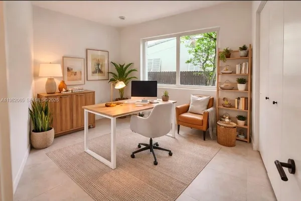 a view of a garden with a building in the background