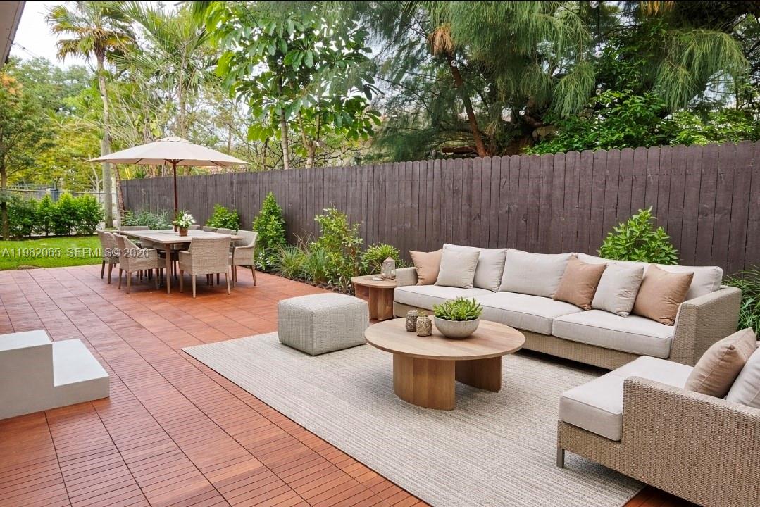 2365 Southwest 21st Avenue Miami, FL 33145 - Photo 8 of 56 a backyard of a house with table and chairs
