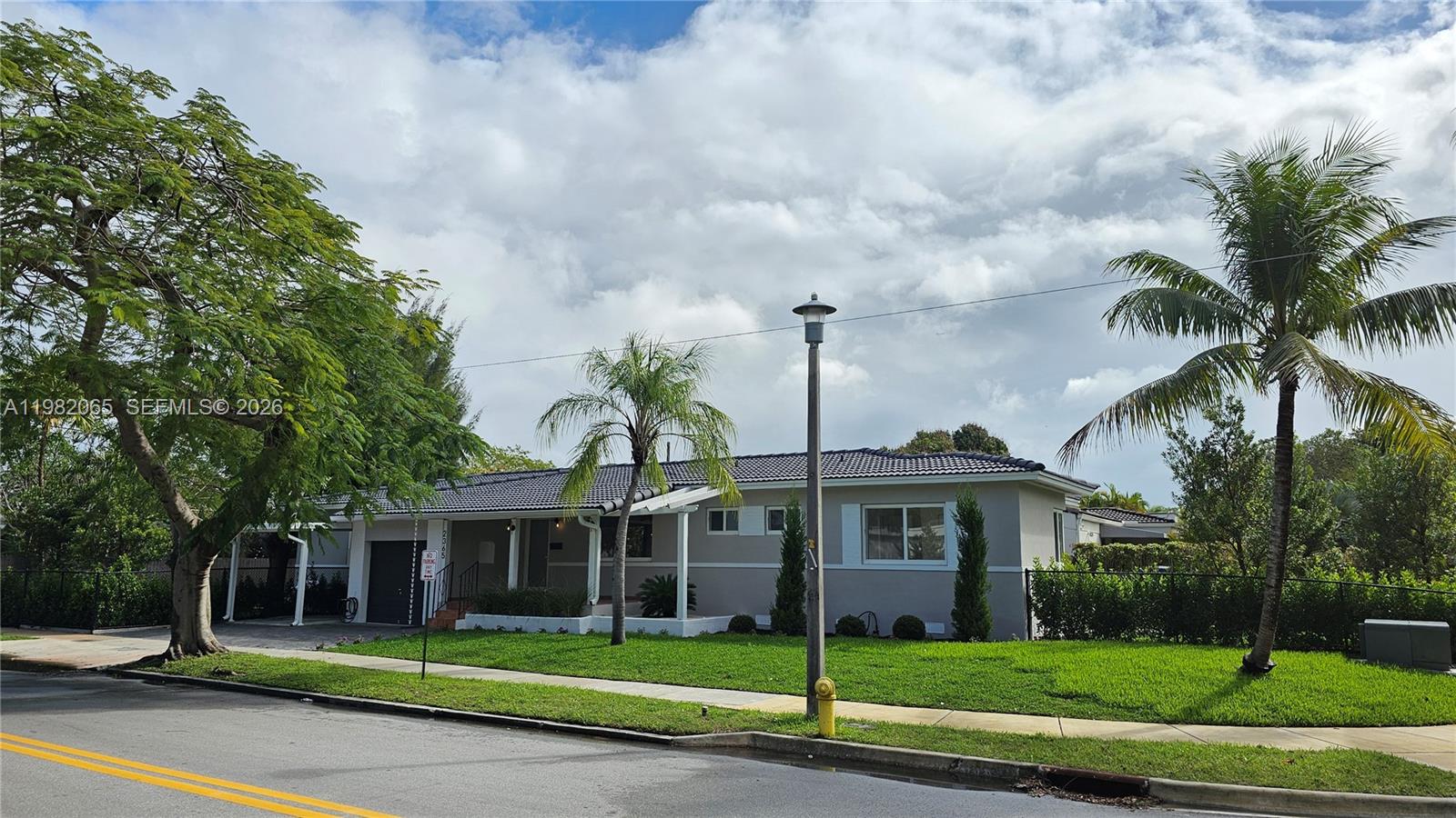 2365 Southwest 21st Avenue Miami, FL 33145 - Photo 10 of 56 a front view of a house with garden