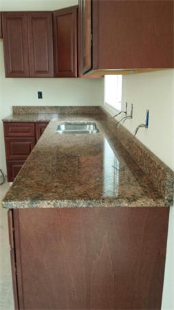 1 Tom Casey Road Spencer, MA 01562 - Photo 11 of 16 a view of a kitchen with granite countertop