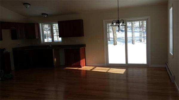 1 Tom Casey Road Spencer, MA 01562 - Photo 7 of 16 a view of an empty room with wooden floor and a window