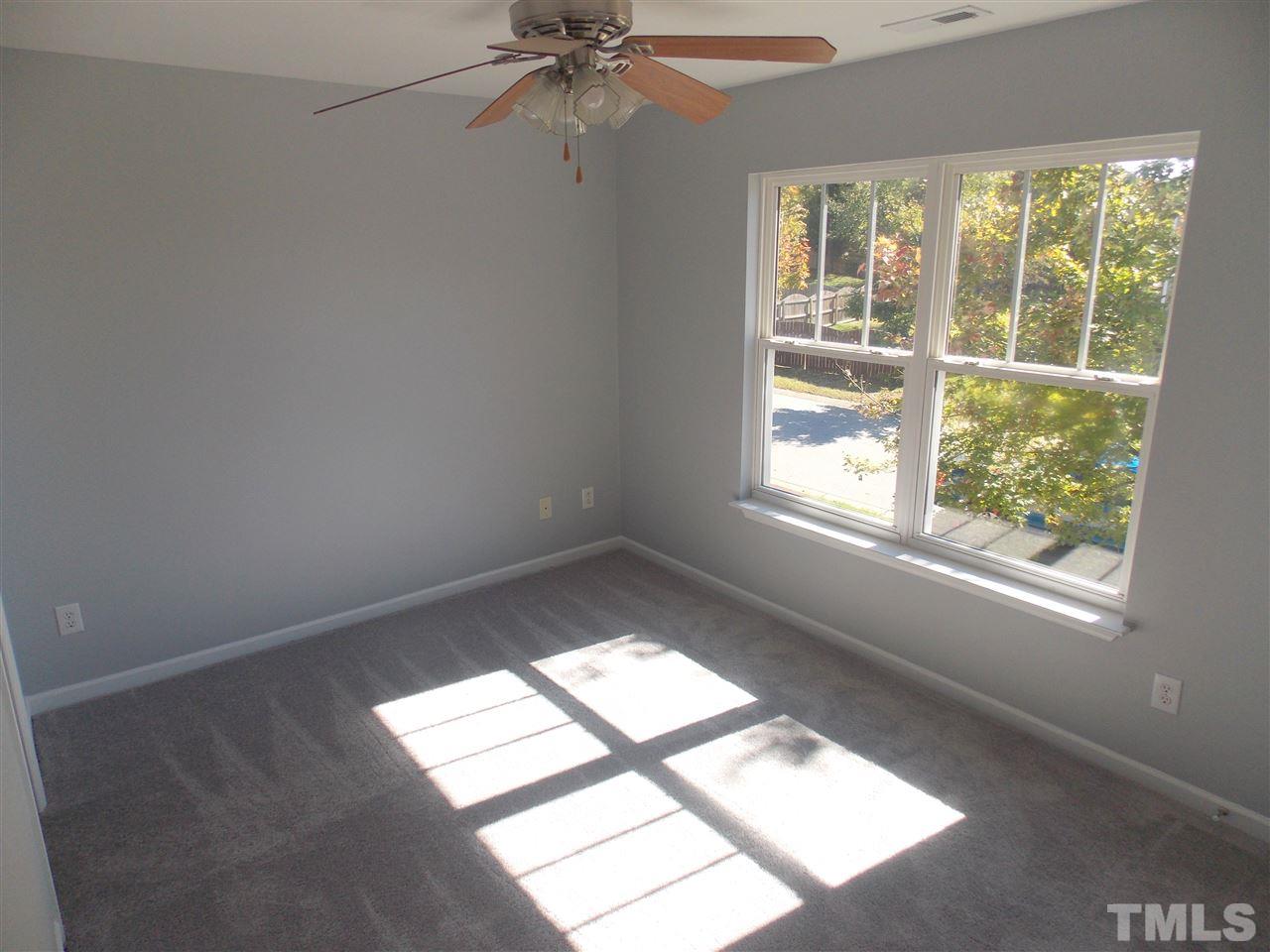 4101 Hopper Street Raleigh, NC 27616 - Photo 11 of 12 an empty room with a window