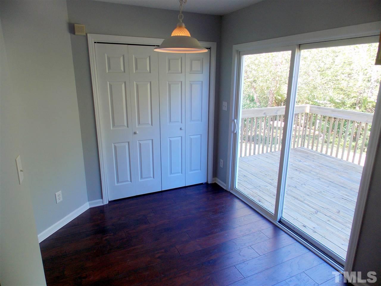 4101 Hopper Street Raleigh, NC 27616 - Photo 7 of 12 a view of empty room with wooden floor and fan