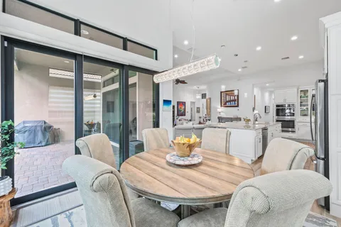 a kitchen with stainless steel appliances granite countertop a stove and cabinets