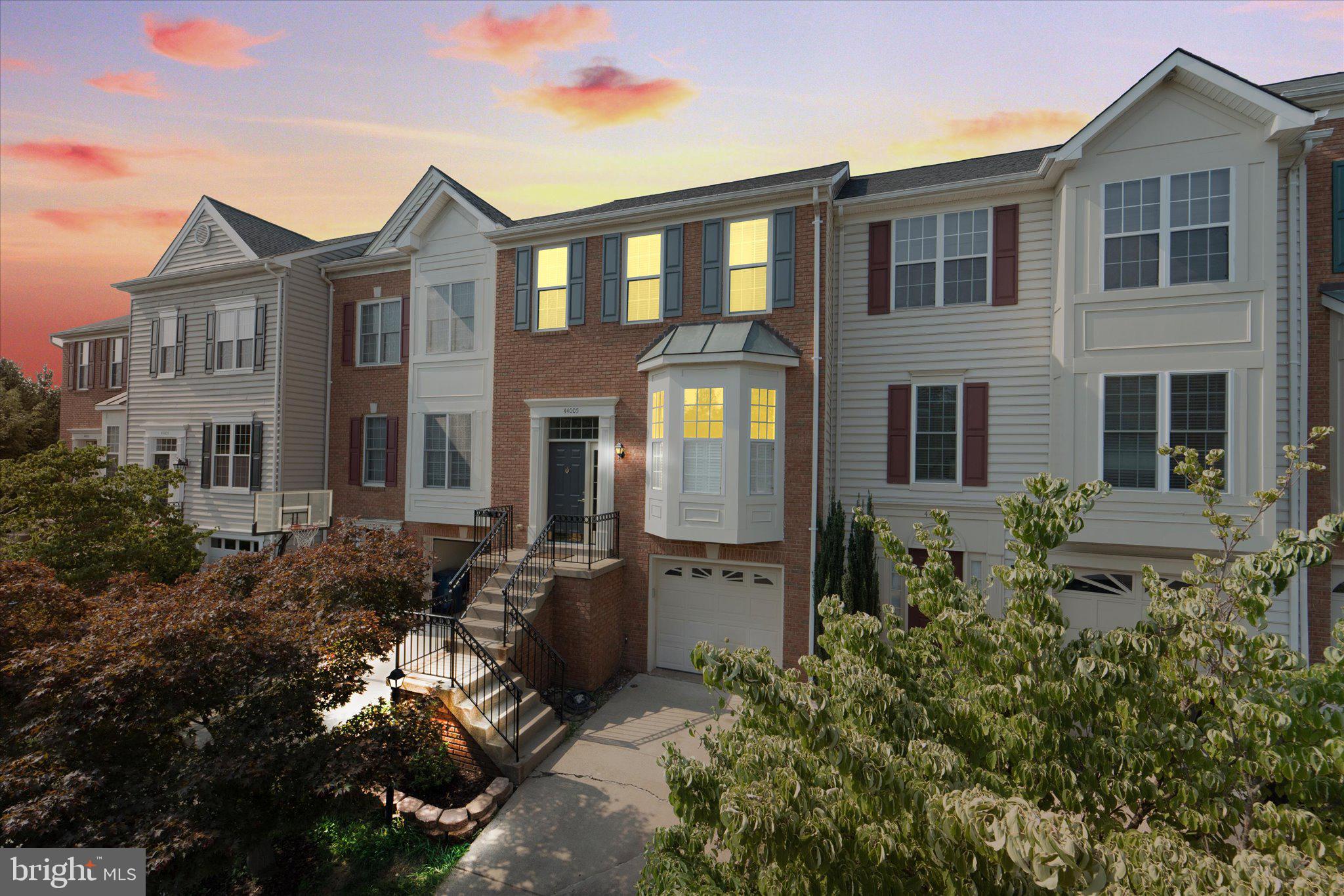 44005 Kings Arms Square Ashburn, VA 20147 - Photo 1 of 58 a front view of a house with balcony
