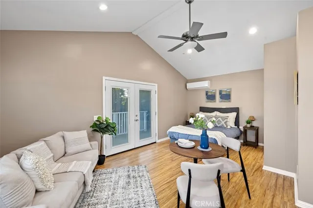 a living room with furniture and white walls
