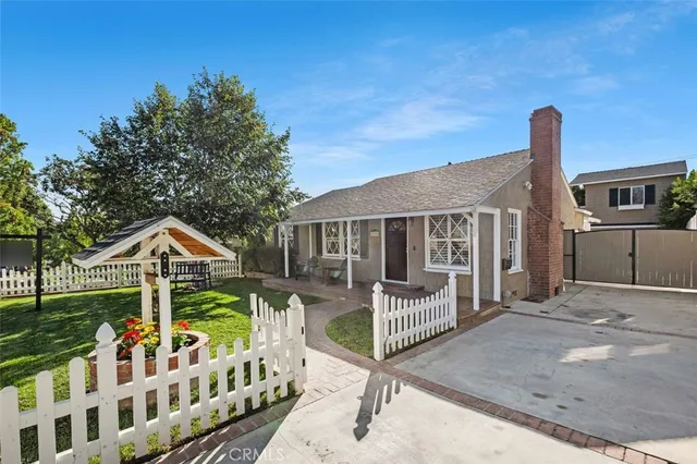 a front view of house with yard porch and furniture
