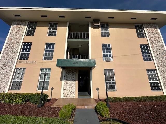 1400 Douglas Road, Unit 14 Coral Gables, FL 33134 - Photo 2 of 19 a front view of a building