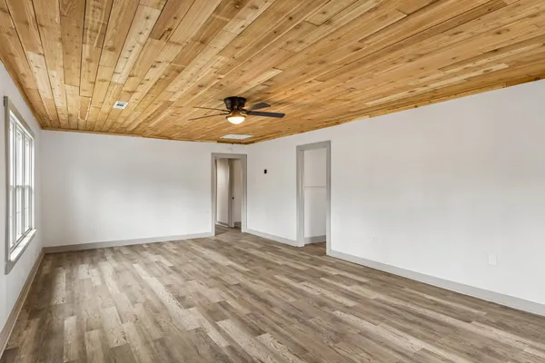 a kitchen with granite countertop a sink stainless steel appliances and cabinets