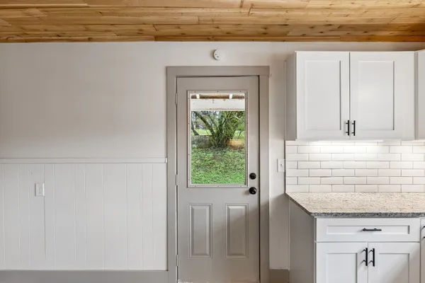 a view of an empty room with a window