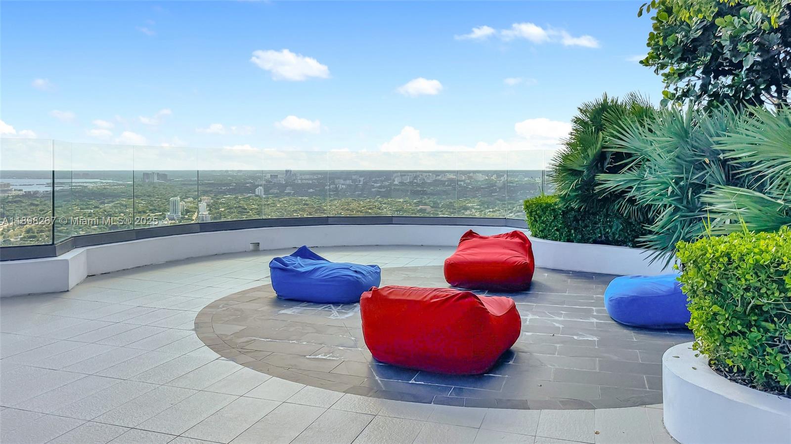 55 Southwest 9th Street, Unit 1802 Miami, FL 33130 - Photo 21 of 35 a view of a chairs and table in a patio