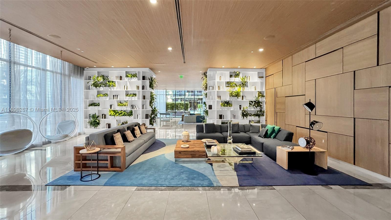 55 Southwest 9th Street, Unit 1802 Miami, FL 33130 - Photo 22 of 35 a living room with furniture and a potted plant