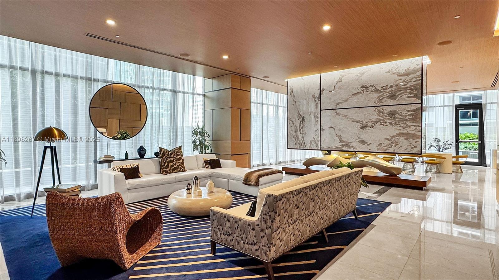 55 Southwest 9th Street, Unit 1802 Miami, FL 33130 - Photo 25 of 35 a living room with furniture and a large window