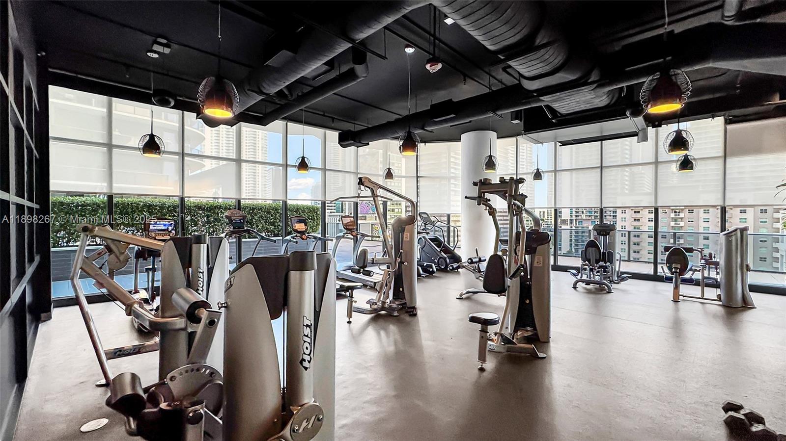 55 Southwest 9th Street, Unit 1802 Miami, FL 33130 - Photo 27 of 35 a view of a room with gym equipment