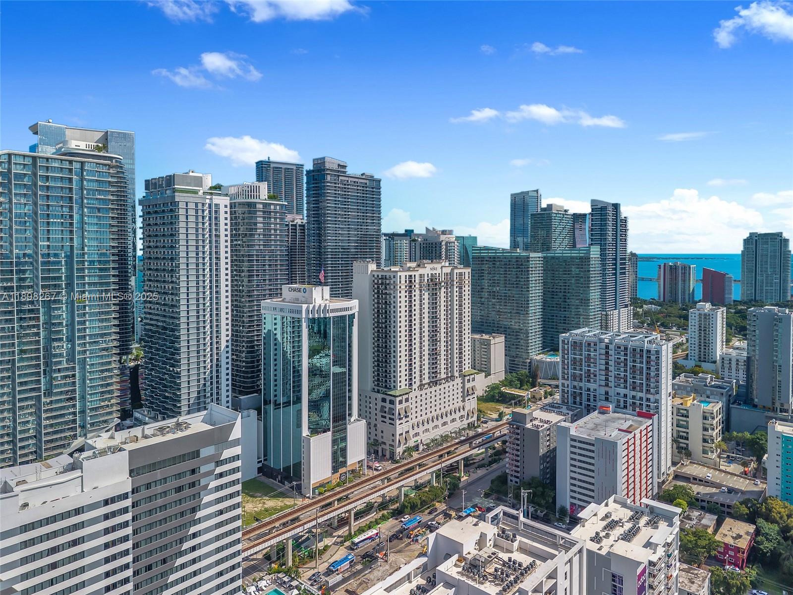 55 Southwest 9th Street, Unit 1802 Miami, FL 33130 - Photo 31 of 35 a view of city with tall buildings