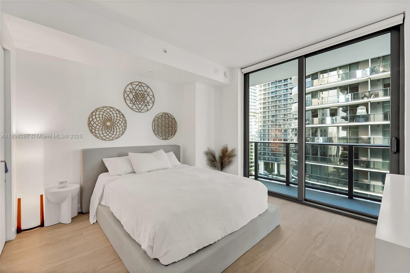 55 Southwest 9th Street, Unit 1802 Miami, FL 33130 - Photo 8 of 35 a bedroom with a large bed and a window