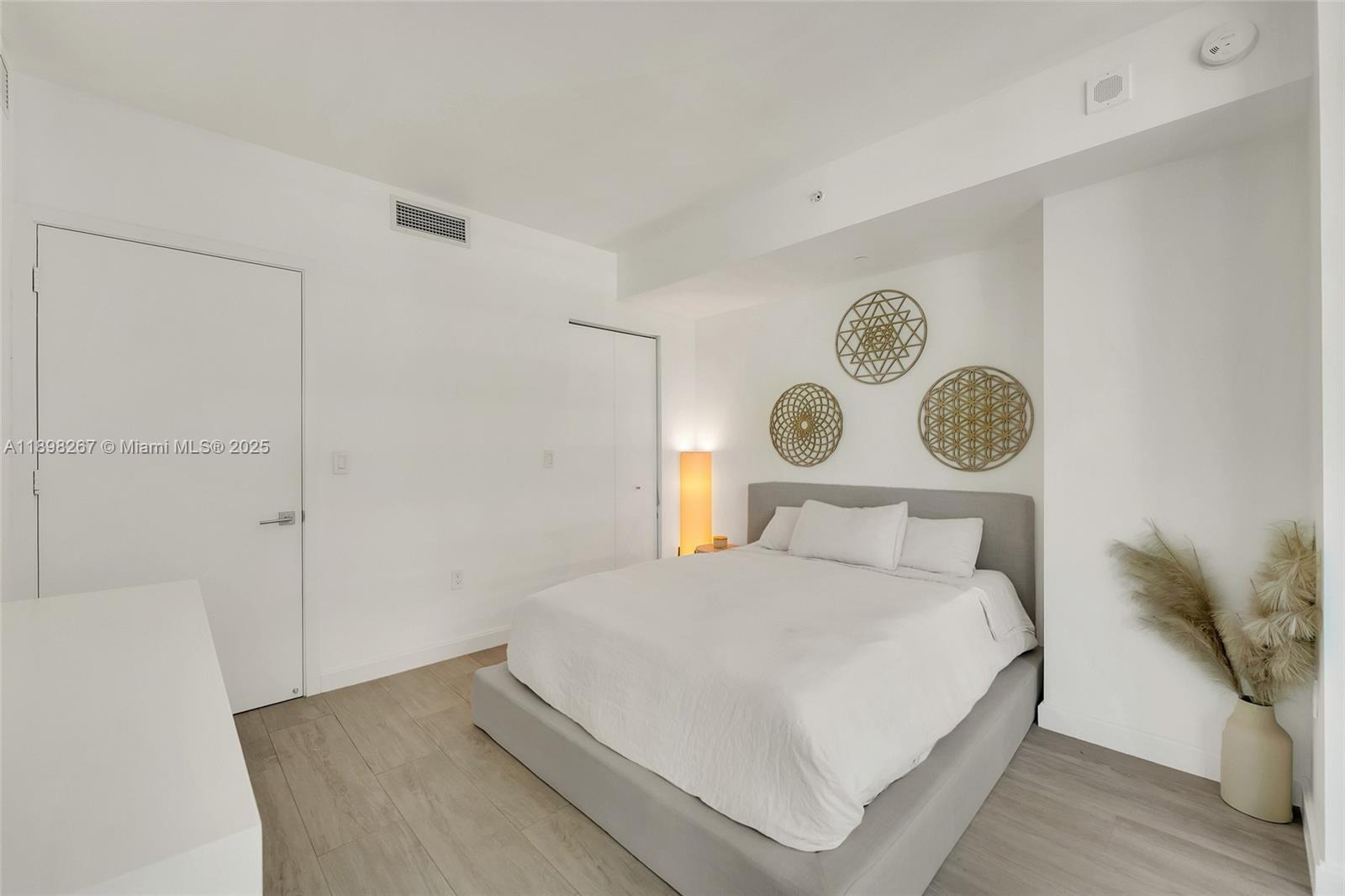 55 Southwest 9th Street, Unit 1802 Miami, FL 33130 - Photo 10 of 35 a bedroom with a bed and a window