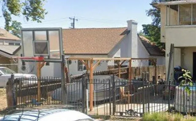 a view of a house with backyard and porch