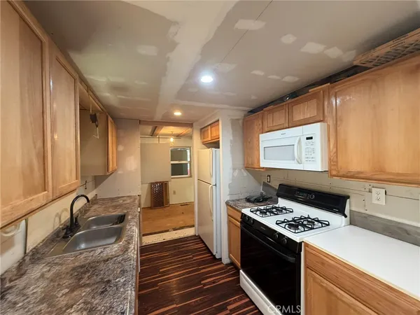 a kitchen with a stove and a sink