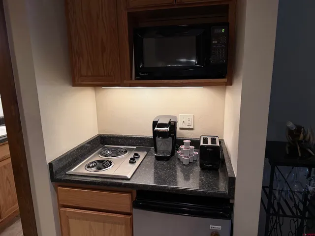 a kitchen with a stove and a microwave